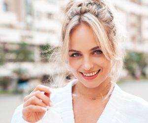 Beautiful young woman outdoors/ halayalex/ envato