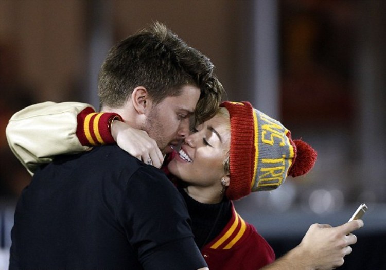 1415950398844_Image_galleryImage_Miley_Cyrus_and_Patrick_S.jpg