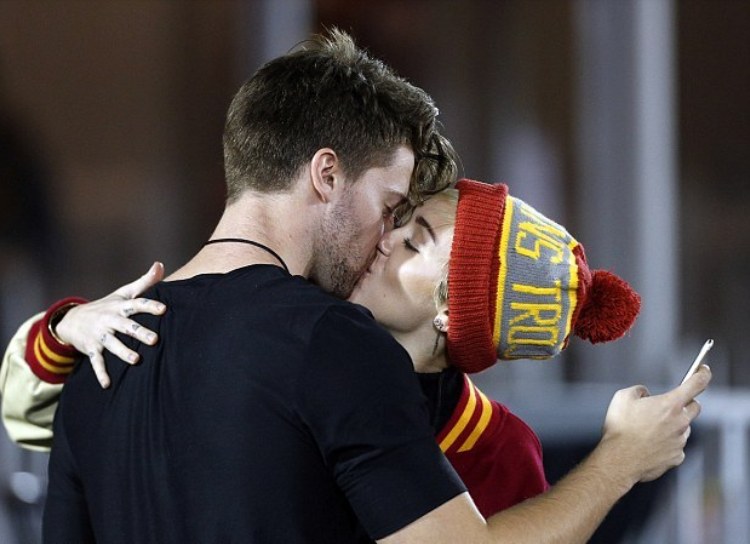1415950419711_Image_galleryImage_Miley_Cyrus_and_Patrick_S.jpg