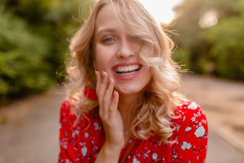 marymandarinka/ attractive stylish blond smiling woman in straw red blouse summer fashion/ envato